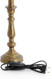 Nahaufnahme eines antik aussehenden Lampenfußes aus Metall mit einem schwarzen Kabel und Schalter.