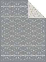 Graue Jacquard-Decke mit geometrischem Muster aus weißen Linien, Draufsicht