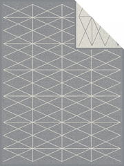 Graue Jacquard-Decke mit geometrischem Muster aus weißen Linien, Draufsicht