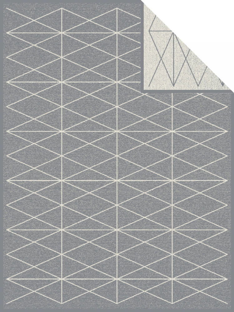 Graue Jacquard-Decke mit geometrischem Muster aus weißen Linien, Draufsicht
