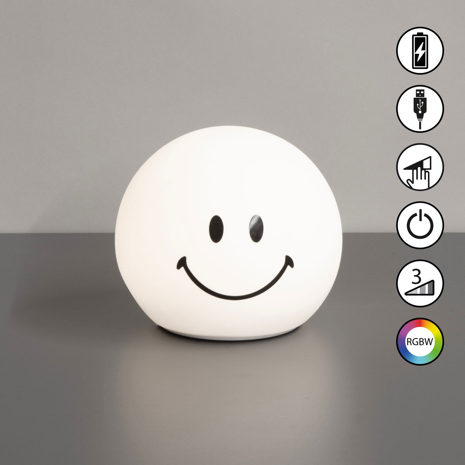 Rundes Akku-Nachtlicht in Form eines Smiley-Gesichts, frontal betrachtet, mit verschiedenen Funktionen wie USB-Ladeanschluss, Touch-Steuerung, Ein-/Ausschalter, drei Helligkeitsstufen und RGBW-Farbwechsel.