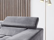 Graues Polstersofa mit verstellbarer Kopfstütze, seitliche Perspektive