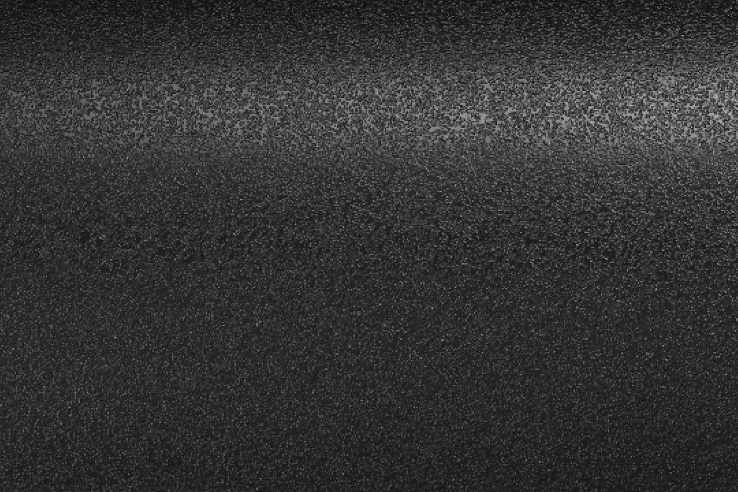 Nahaufnahme der schwarzen, strukturierten Oberfläche eines 2-er Toasters aus Gussmaterial.