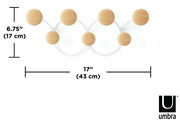 Vorderansicht der Umbra Wandgarderobe DOTSY mit fünf runden Holzhaken auf weißem Hintergrund, Maße 17 cm hoch und 43 cm breit.