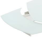 Nahaufnahme eines modernen Esstisches mit abgerundeten Kanten und weißer Glasoberfläche, von oben betrachtet.