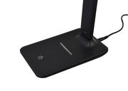 Nahaufnahme der Basis einer schwarzen LED-Schreibtischleuchte Timezo mit Touch-Bedienfeld und Stromkabel.