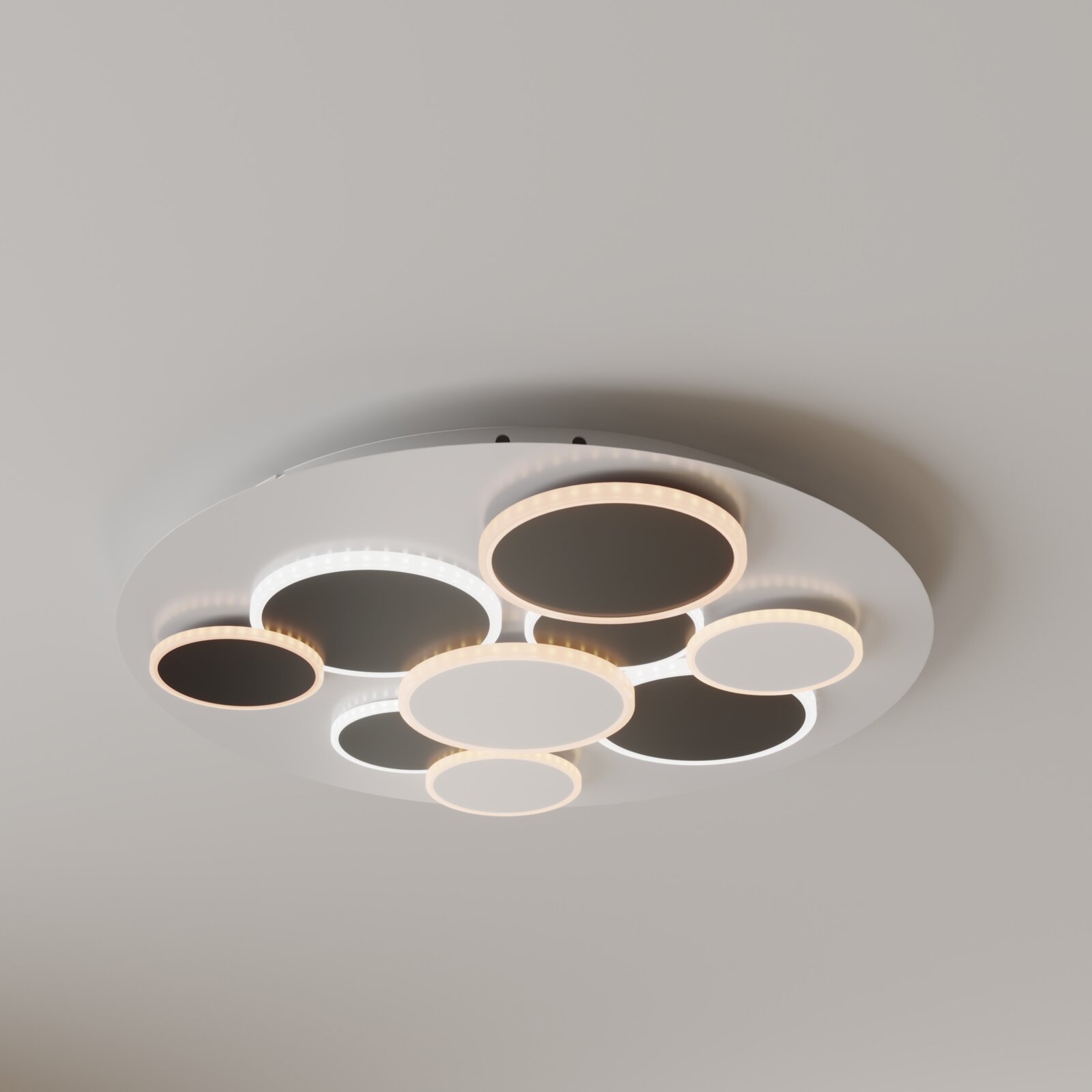 Moderne runde LED-Deckenleuchte in Weiß mit mehreren kreisförmigen Leuchtringen in Warm- und Kaltweiß, Aufnahme aus Untersicht (von unten) an der Decke