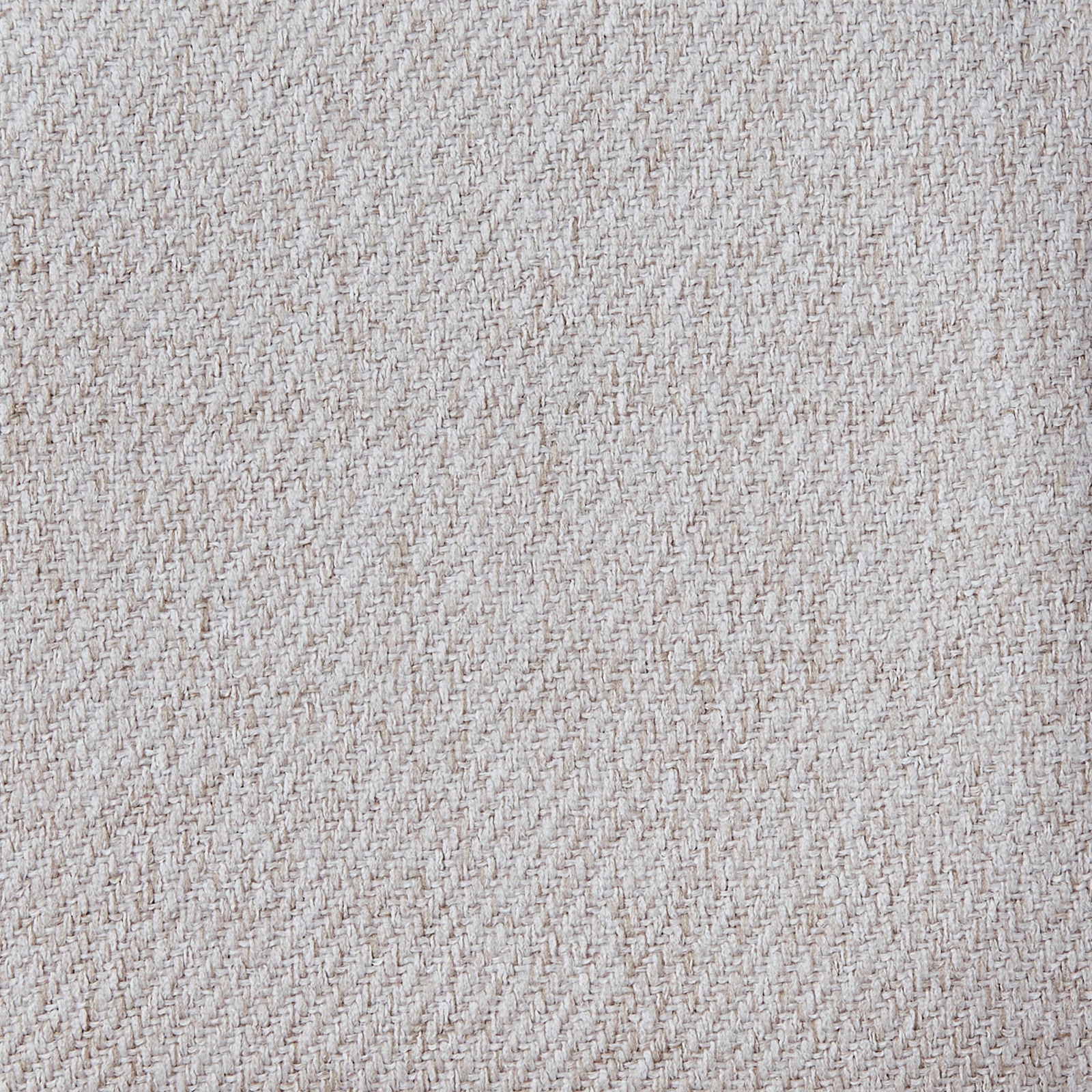 Nahaufnahme eines beigen Stoffmusters mit diagonaler Webstruktur.