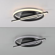 Moderne LED-Deckenleuchte mit kreisförmigem Design und zwei überkreuzten Leuchtstreifen, seitliche Perspektive.
