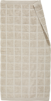 Beiges Frottiertuch mit Karomuster, ausgebreitet in der Draufsicht