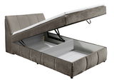 Boxspringbett mit geöffnetem Stauraum, seitliche Perspektive