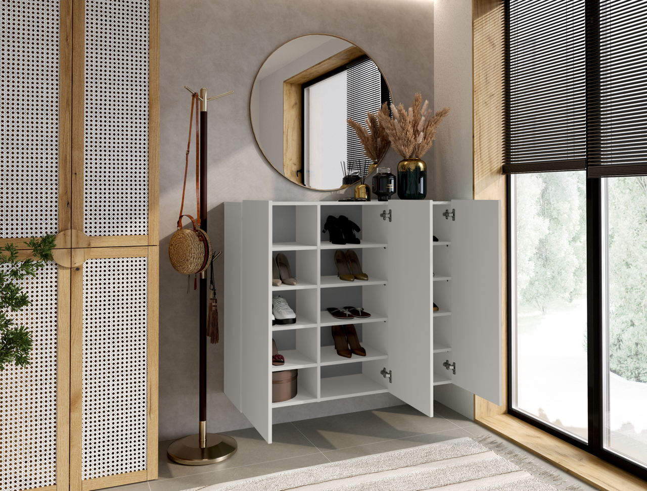 Moderner weißer Hängeschuhschrank mit offenen Türen, gefüllt mit Schuhen, in einem stilvoll eingerichteten Raum mit rundem Spiegel und Fenster im Hintergrund, seitliche Perspektive.