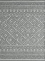 Draufsicht auf einen grauen, gewebten Teppich mit geometrischem Rauten- und Zickzackmuster sowie dekorativen Bordüren an den Kanten.