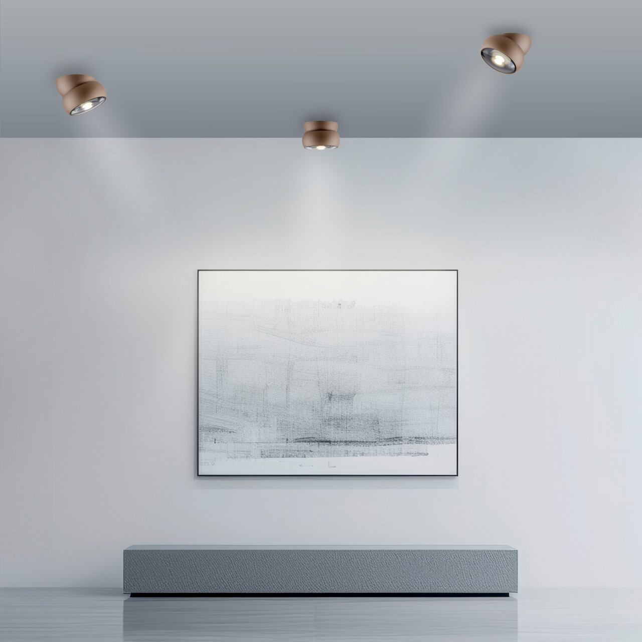 Neuhaus Pure LED-Deckenleuchte PURE MOVE Moderne LED-Deckenleuchte in einem minimalistischen Raum, von unten betrachtet, mit drei Strahlern, die ein Kunstwerk an der Wand beleuchten.