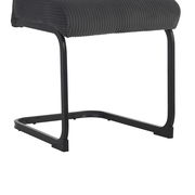 Schwingstuhl mit schwarzem Metallgestell und gepolsterter Sitzfläche in Seitenansicht