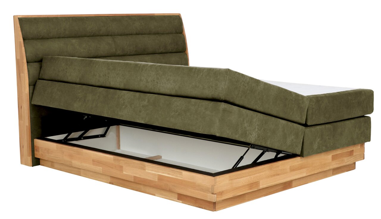 Boxspringbett mit hochgeklappter Matratze und Stauraum, seitliche Perspektive