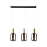 Drei moderne Pendelleuchten mit rauchgrauen Glaskörpern und goldenen Fassungen, von vorne betrachtet.