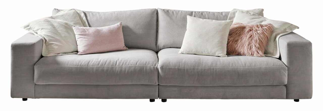 Großes, graues Sofa mit mehreren Kissen in verschiedenen Farben, frontal fotografiert.