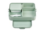 Grüne Bento-Lunchbox mit mehreren Fächern und einem kleinen Behälter, von oben betrachtet.