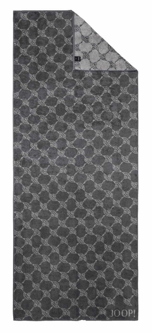 Grijze saunadoek met geometrisch patroon en JOOP!-logo, van bovenaf gefotografeerd.