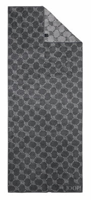 Grijze saunadoek met geometrisch patroon en JOOP!-logo, van bovenaf gefotografeerd.