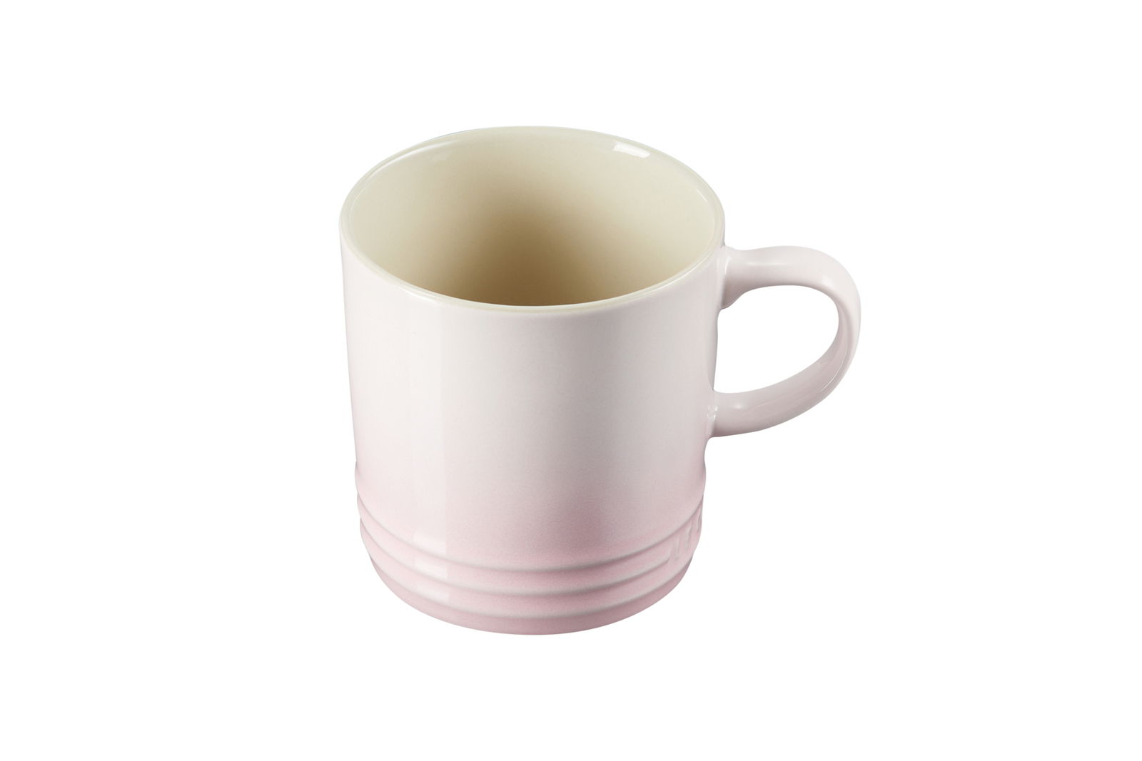 Rosa Becher aus Keramik, schräg von oben fotografiert