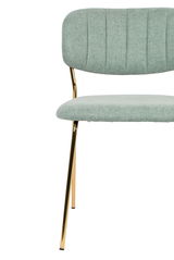Moderner Stuhl mit mintgrünem Stoffbezug und goldenen Metallbeinen, Vorderansicht