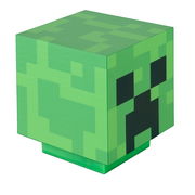 Grüner, würfelförmiger Minecraft-Creeper-Block mit pixeligem Muster und schwarzem Gesicht, freigestellt auf weißem Hintergrund, in schräger Vorderansicht (3/4-Perspektive) von oben.