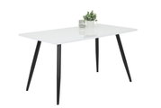 Moderner Esstisch mit weißer Tischplatte und schwarzen, schrägen Beinen, seitliche Perspektive, dekoriert mit einer kleinen Pflanze und einem Glasgefäß.