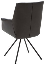 Achterkant van een moderne fauteuil met zwarte lederen bekleding en slanke metalen poten.