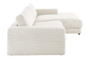 Zijaanzicht van een crèmekleurige longchair-set met geribbelde stoffen bekleding.
