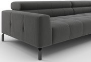 Donkergrijze modulaire bank met ribstof bekleding, blokstiksels en zwarte metalen poten, schuin van voren links gefotografeerd
