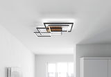 Moderne LED-Deckenleuchte mit geometrischem Design aus Holz und Metall, von unten betrachtet.