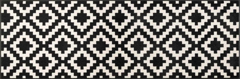 Schwarz-weiße Fußmatte mit geometrischem Muster, Draufsicht