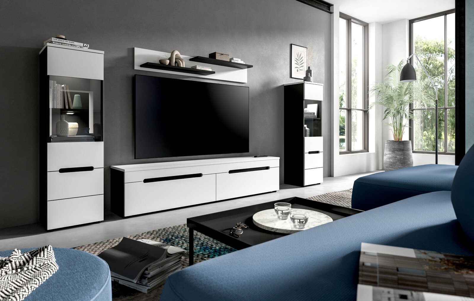 MID.YOU Wohnkombination CANU Modernes Wohnzimmer mit weiß-schwarzer TV-Wohnwand (Lowboard, Hängeregal und zwei Vitrinenschränke) vor grauer Wand, frontal aus leicht seitlicher Perspektive aufgenommen.