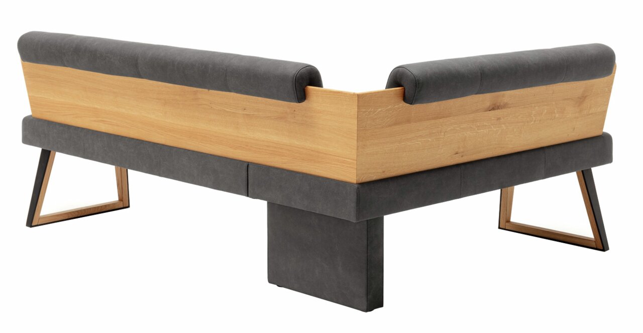 Rückansicht einer modernen Eckbank mit Holz- und Polsterelementen, perspektivisch von hinten rechts aufgenommen.