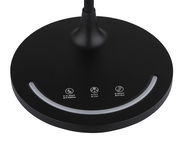 Nahaufnahme der Basis einer schwarzen Tischleuchte mit Touch-Bedienelementen für Helligkeit, Farbtemperatur und Verzögerung. Ansicht von oben.