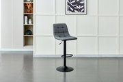 Grauer Barhocker mit gepolsterter Sitzfläche und schwarzem Metallgestell, seitliche Perspektive