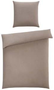 Bettwäsche-Set in Beige, bestehend aus einem Kissenbezug und einem Bettdeckenbezug, aus der Vogelperspektive fotografiert.