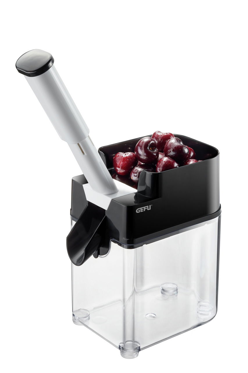 Kirschentkerner mit gefülltem Behälter, seitliche Perspektive