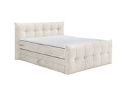 Boxspringbett in hellem Stoffbezug, seitliche Perspektive