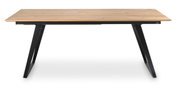 Moderne eettafel met houten blad en zwarte metalen poten, zijaanzicht