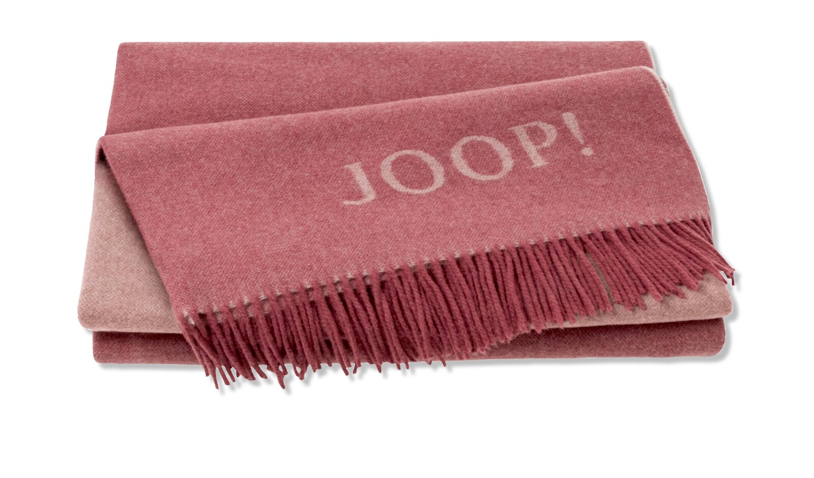 Roze deken met franjes en JOOP!-logo, opgevouwen en van bovenaf gefotografeerd