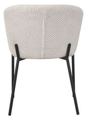 Rückansicht eines modernen Stuhls mit cremefarbenem, strukturiertem Stoffbezug und schwarzen Metallbeinen.