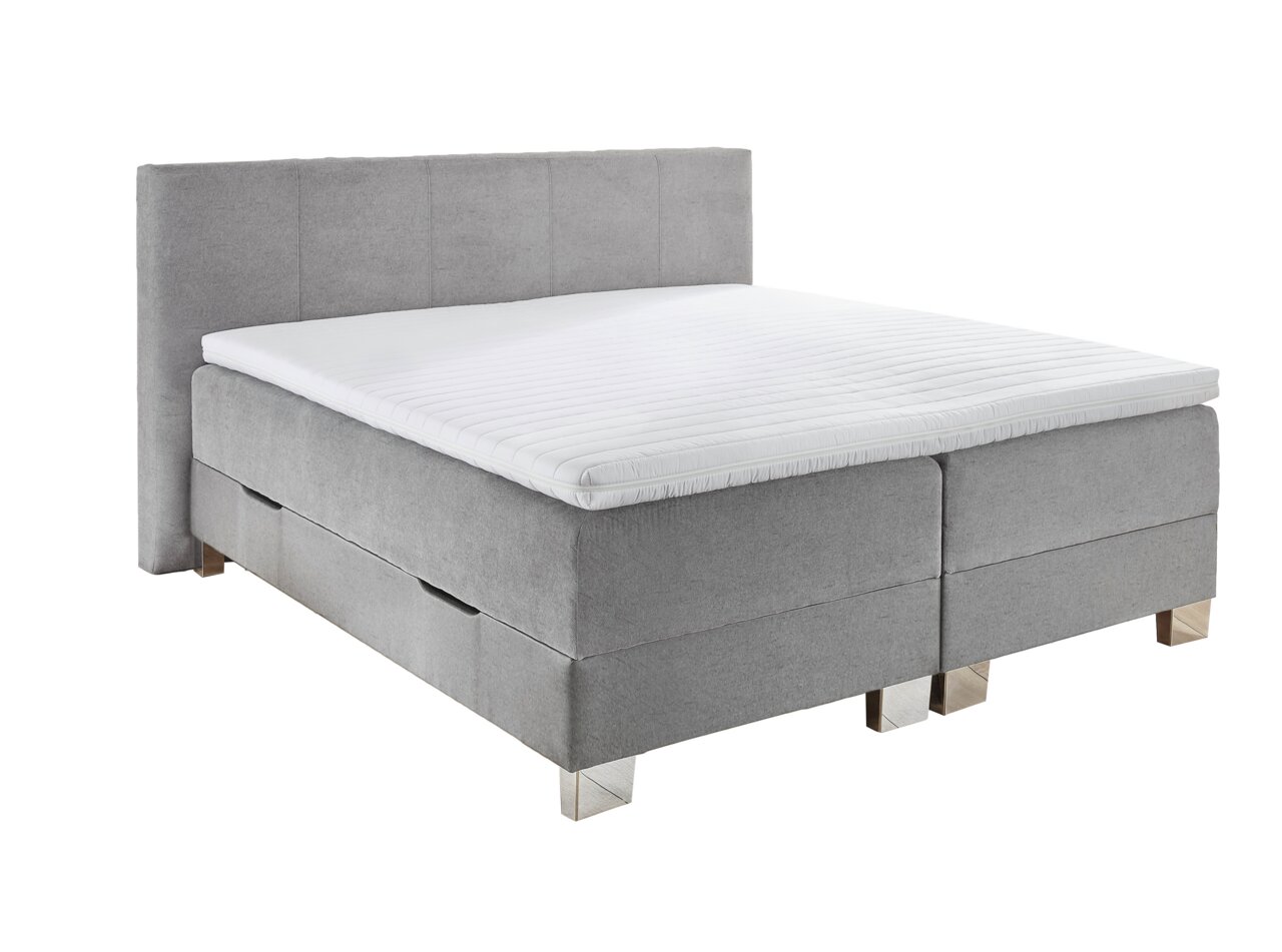 Graues Boxbett mit gepolstertem Kopfteil und weißer Matratze, seitliche Perspektive