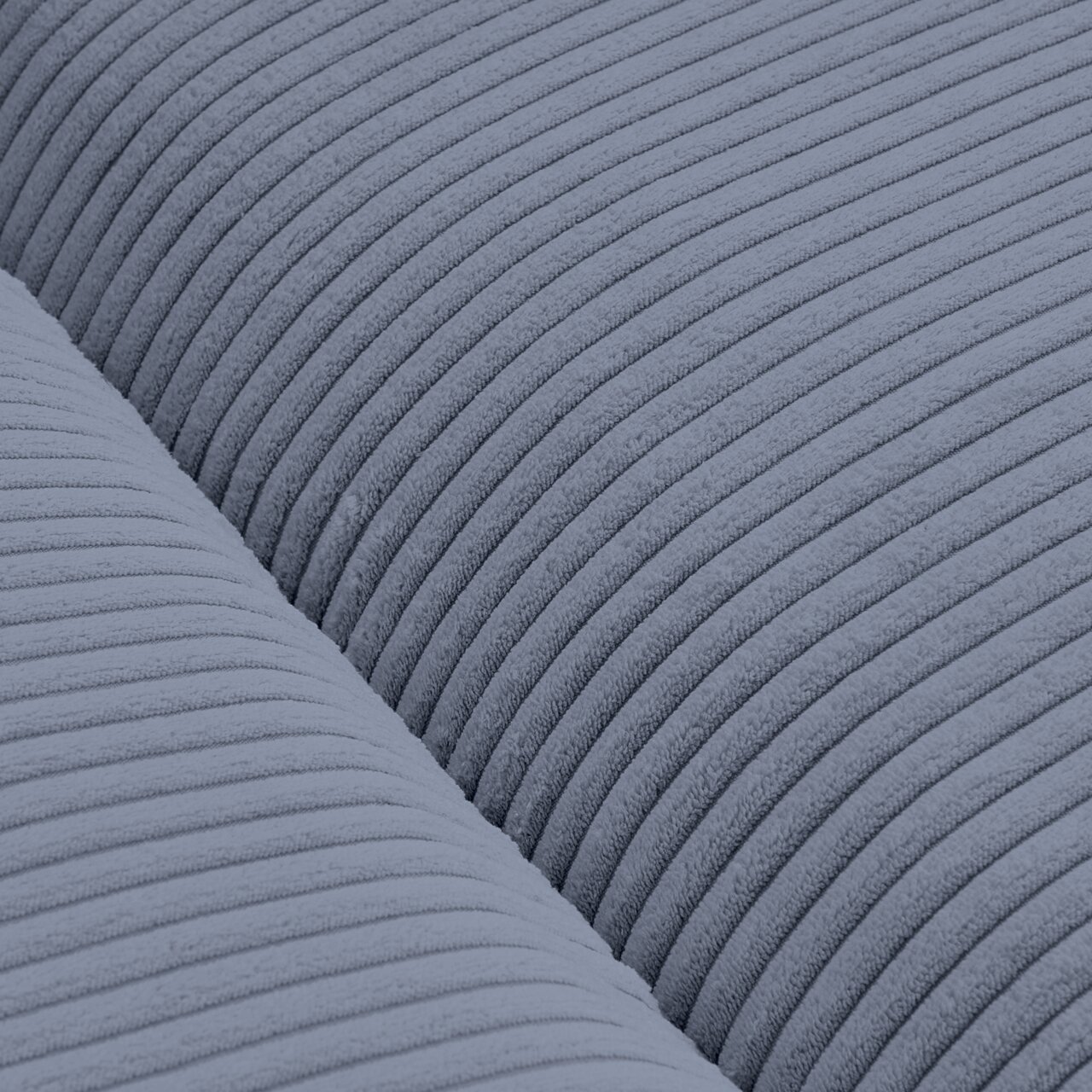 Nahaufnahme eines blauen, gerippten Stoffes eines Big-Sofas in Draufsicht.