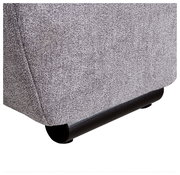Nahaufnahme der unteren Ecke eines grauen Big Sofas TAVANI mit schwarzem Fuß, seitliche Perspektive.