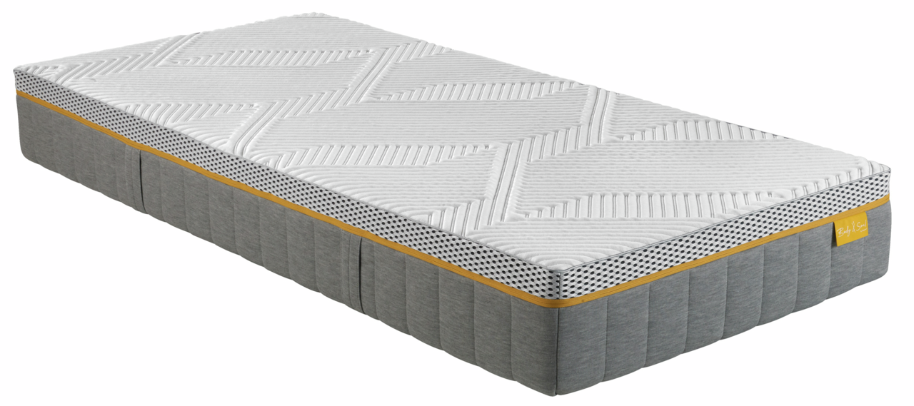 irisette Matratze 90x200 soft BODY&SOUL Seitliche Ansicht einer irisette Matratze 90x200 BODY&SOUL mit gestepptem weißen Bezug und grauem Rand.