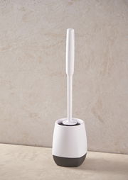 Toilettenbürste in einem weißen und schwarzen Halter, seitliche Perspektive