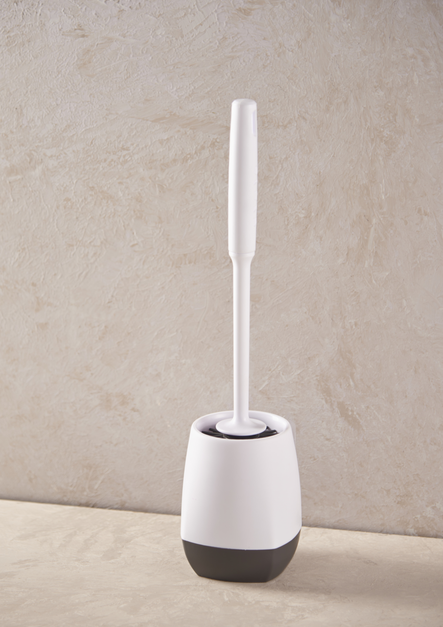 Toilettenbürste in einem weißen und schwarzen Halter, seitliche Perspektive